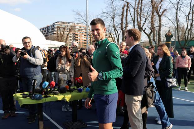 Novak Djokovic gestures during a news conference in Belgrade