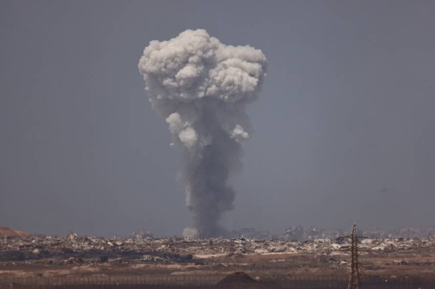 Smoke rises from Gaza after an explosion as seen from the Israeli side of the border