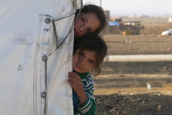 Displaced Iraqi girls are seen in Kokjali village near Mosul
