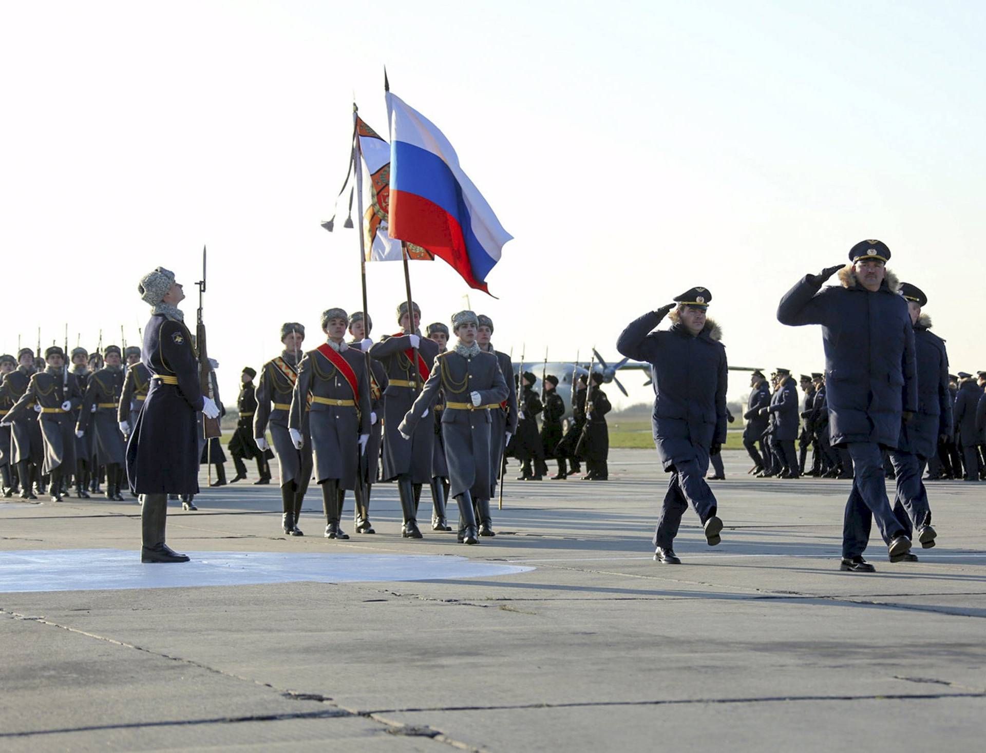 Russian Ministry of Defence handout photo shows servicemen taking part in a ceremony to welcome Russian military aircraft and pilots after they arrived from Syria, at an airbase in Krasnodar region, southern Russia