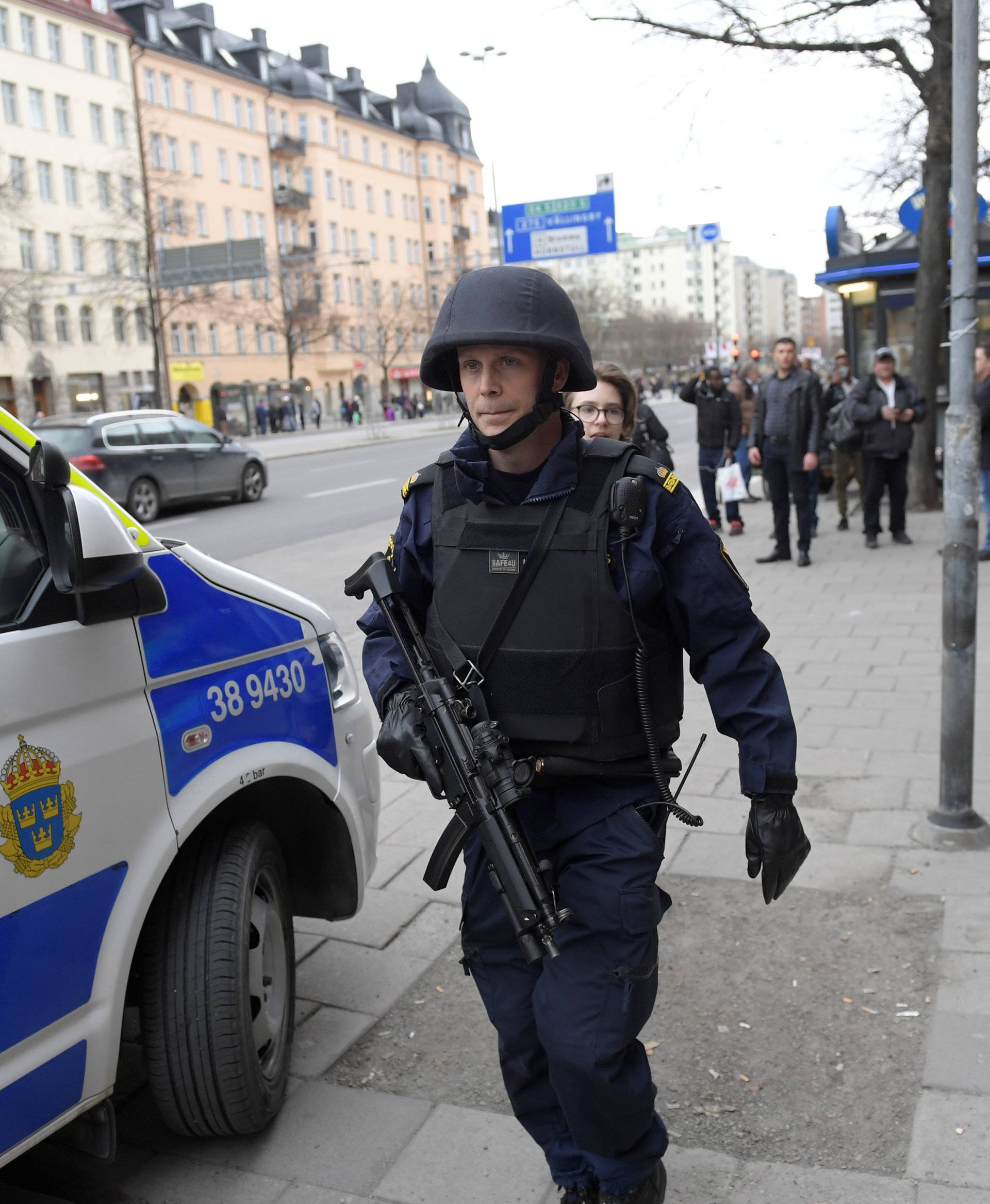 A police officer is seen at the area where people were killed when a truck crashed into department store Ahlens, in central Stockholm