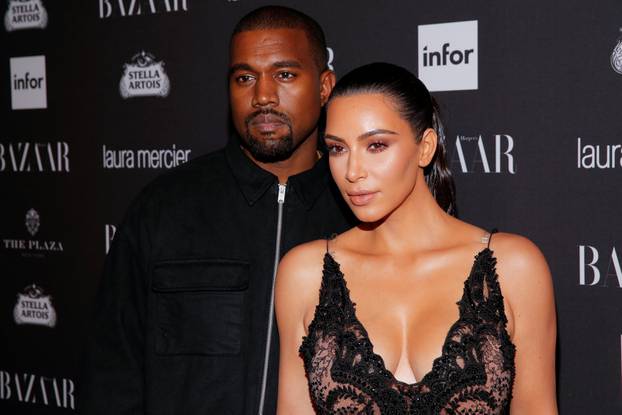 Kanye West and Kim Kardashian attend Harper