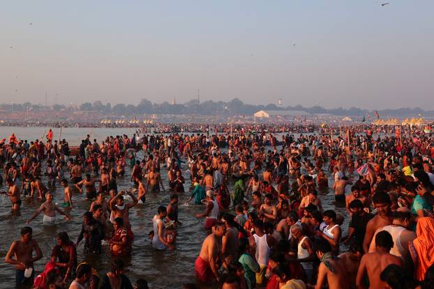Devotees take a dip at Sangam during "Maha Kumbh Mela" in Prayagraj