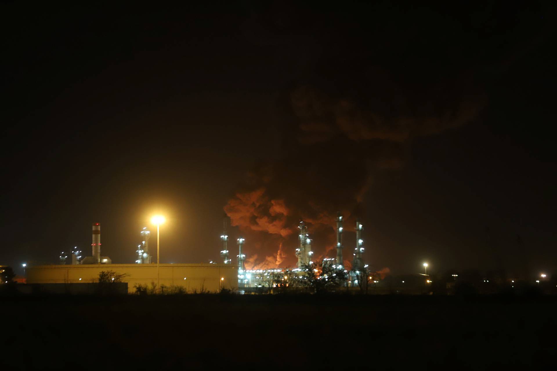 Smoke rises at an oil refinery in Tehran