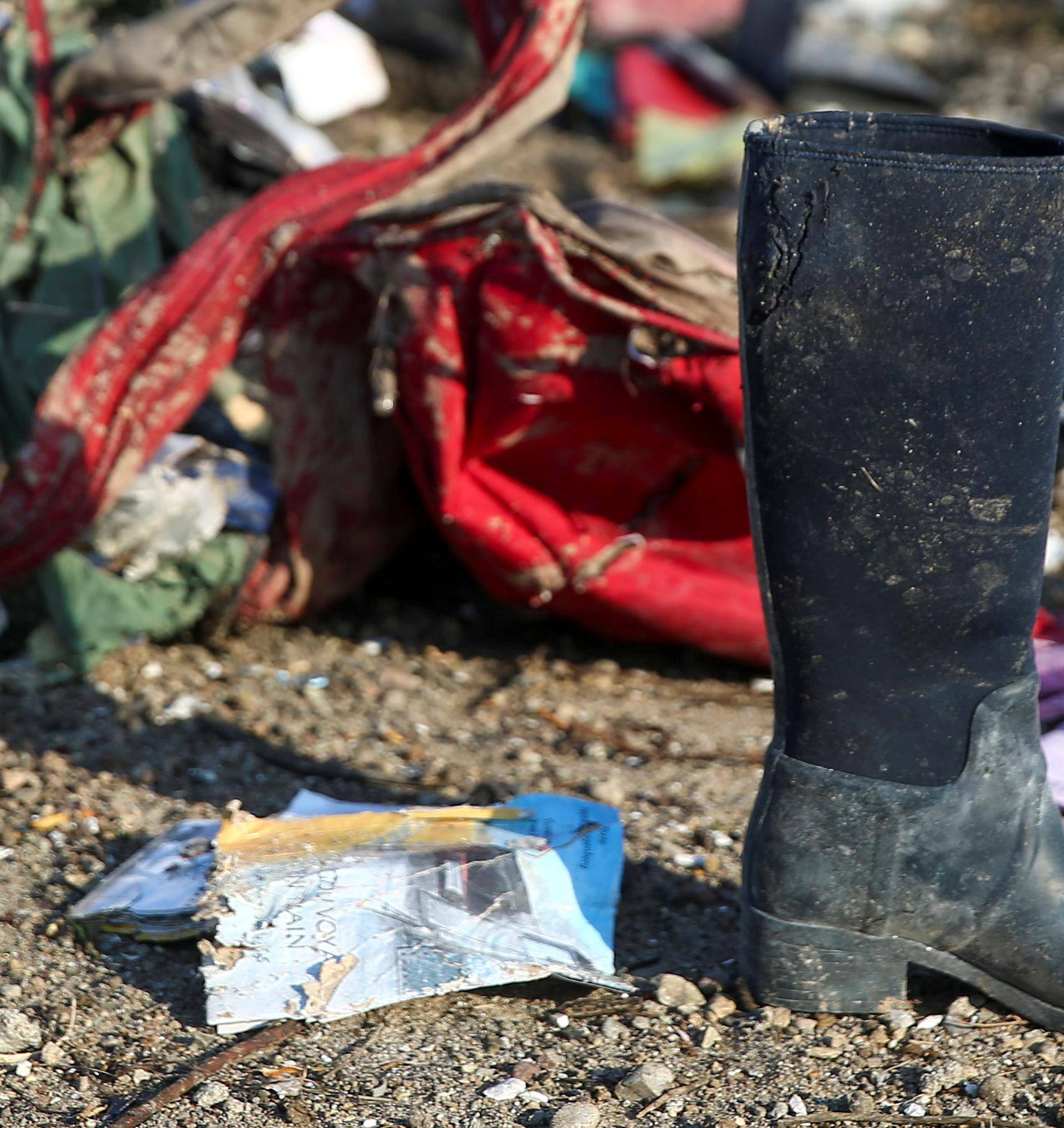 Passengers' belongings are pictured at the site where the Ukraine International Airlines plane crashed after take-off from Iran's Imam Khomeini airport, on the outskirts of Tehran