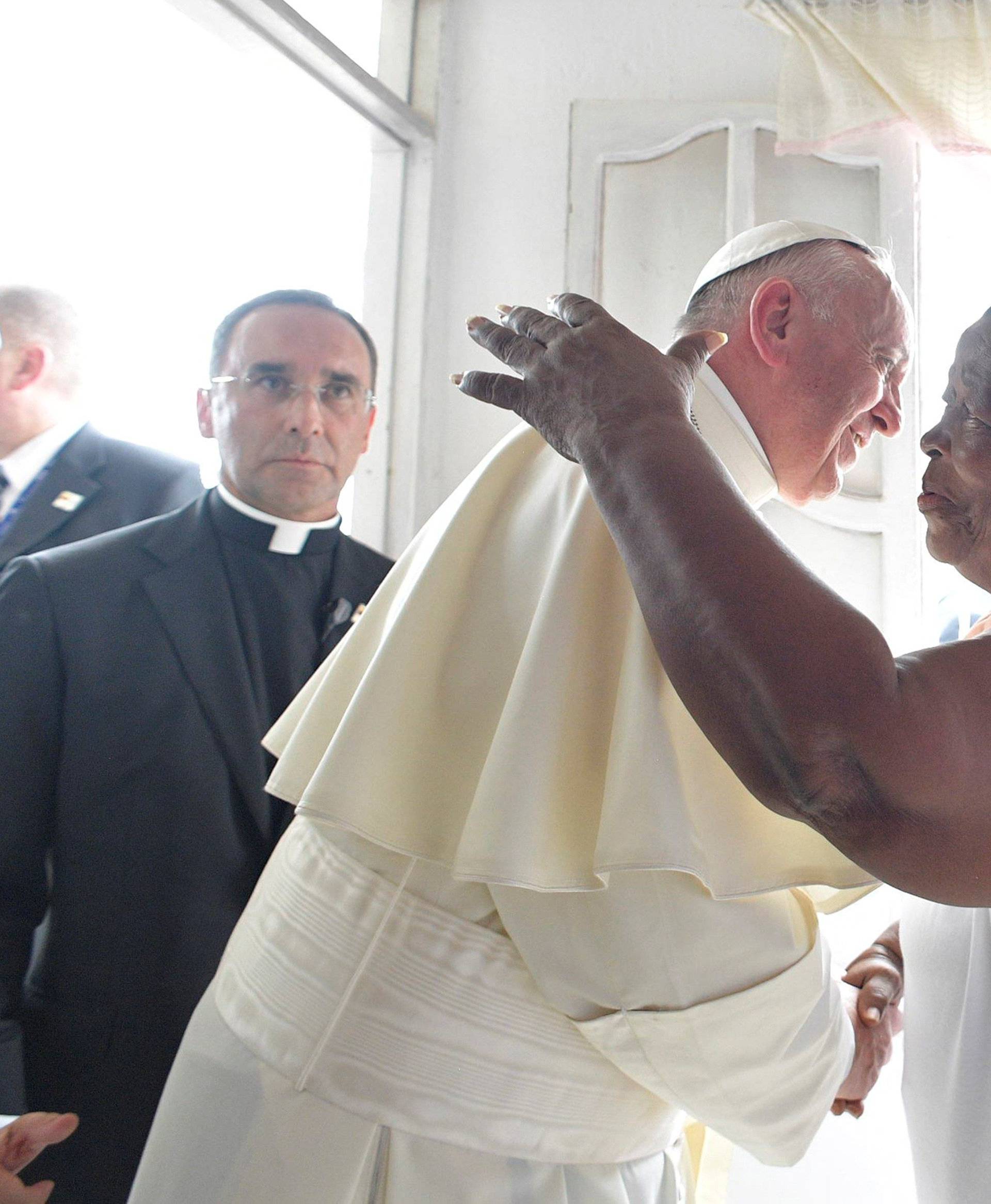 Pope Francis greets Lorenza Perez at her home in Cartagena