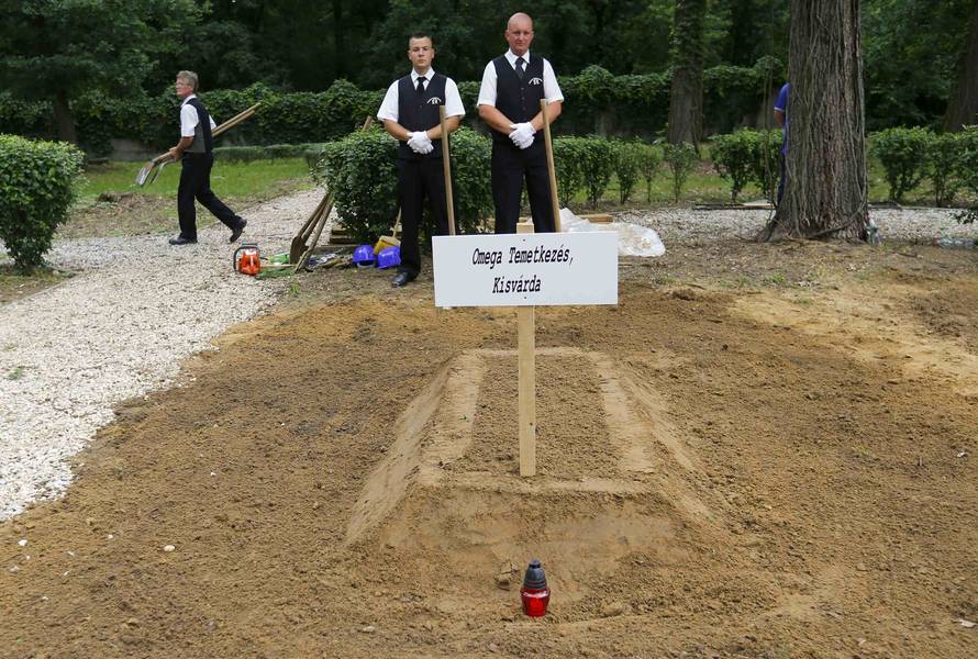 Gravediggers pose after Hungarian grave digging championship in Debrecen
