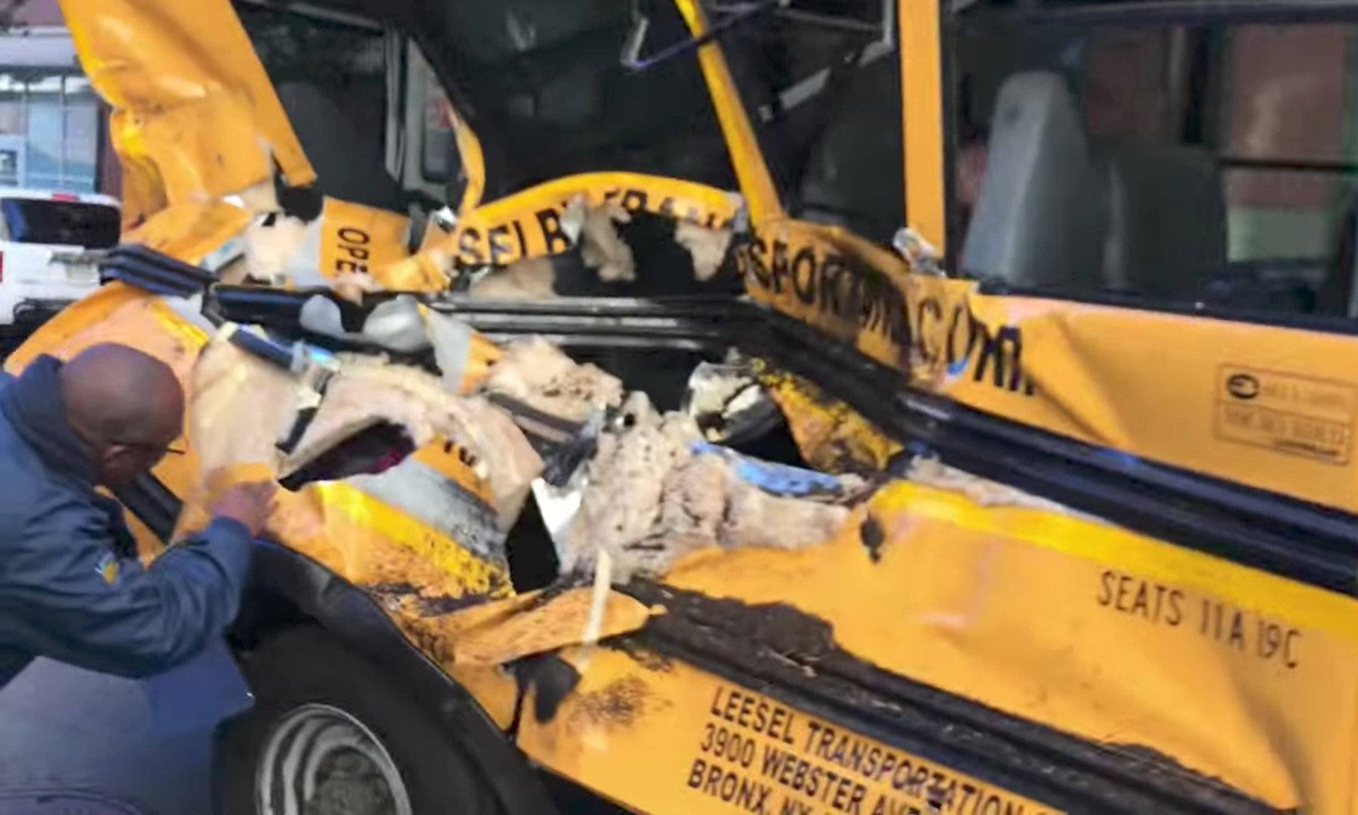 A damaged school bus is seen at the scene of a pickup truck attack in Manhattan, New York