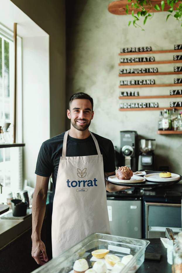 Waiter posing with tray