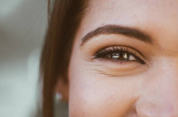Beautiful woman and her blue eyes, macro shot