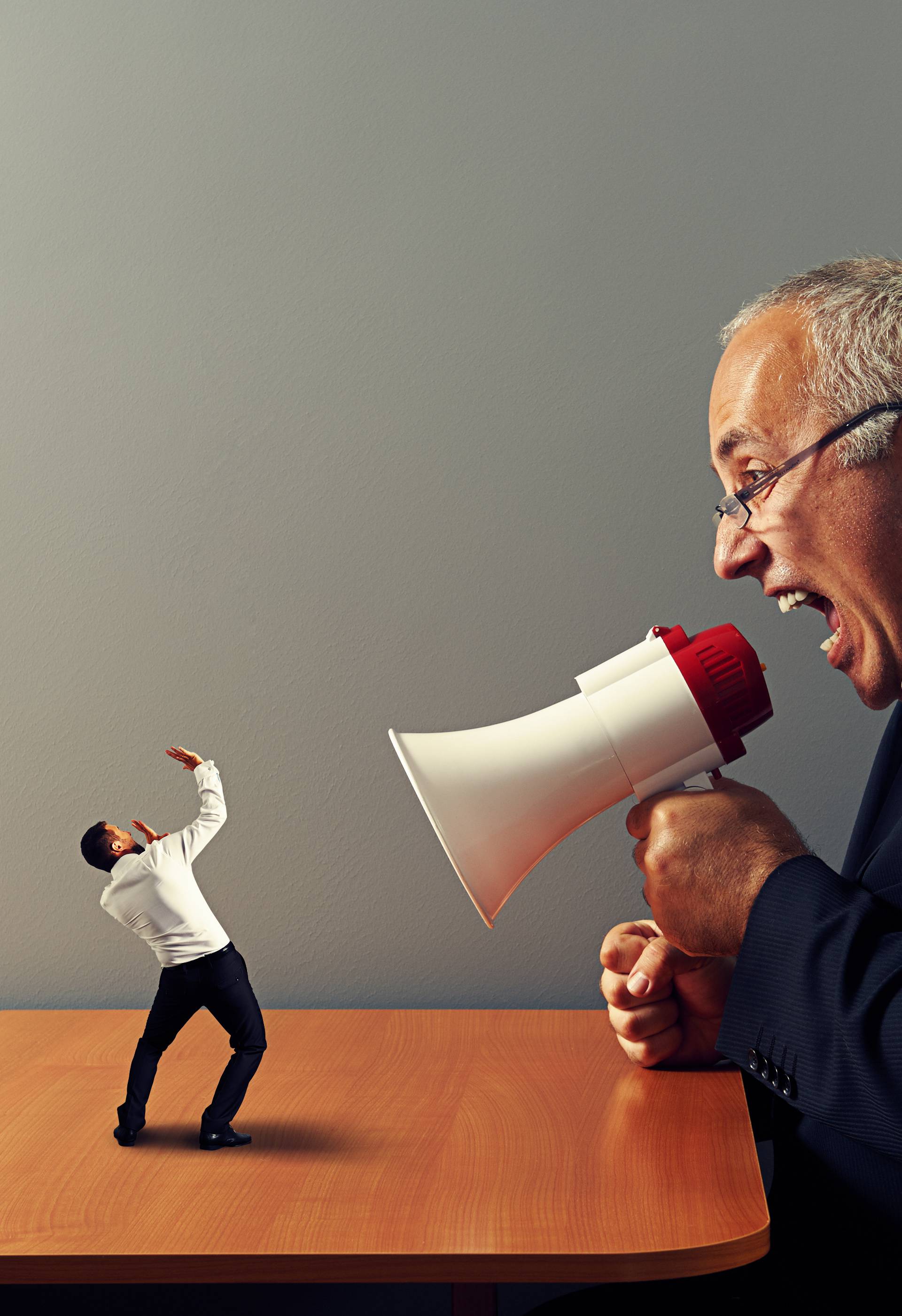 boss screaming at small businessman