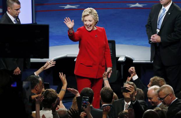 Democratic U.S. presidential nominee Hillary Clinton waves after the first presidential debate against Republican U.S. presidential nominee Donald Trump at Hofstra University in Hempstead