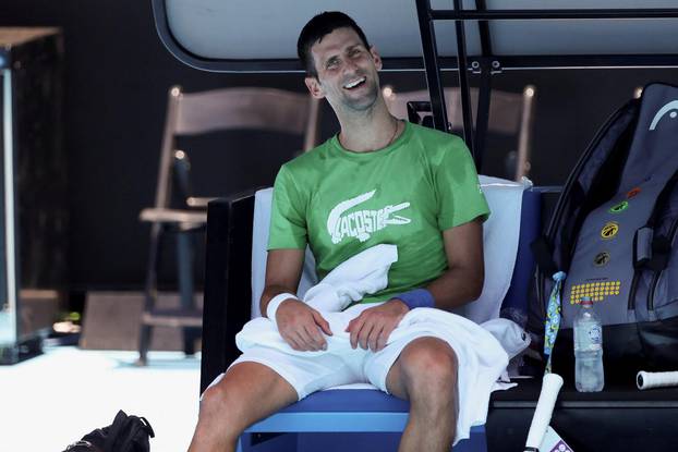 Serbian tennis player Novak Djokovic practices at Melbourne Park as questions remain over the legal battle regarding his visa to play in the Australian Open