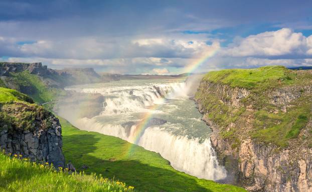 Gulfloss Waterfall with rainbow in Iceland