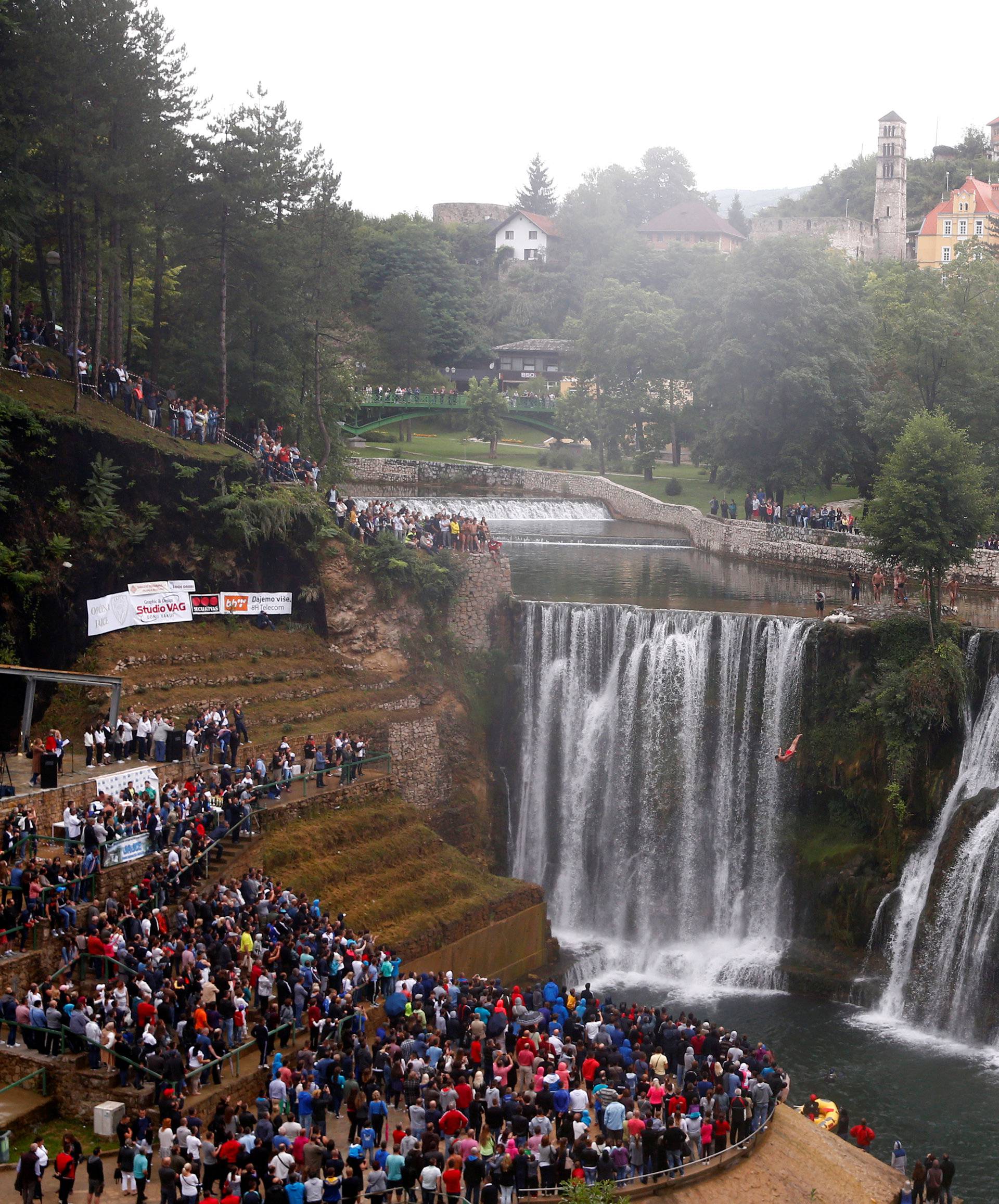 A competitor takes part in the third international waterfall jumping competition held in the old town of Jajce