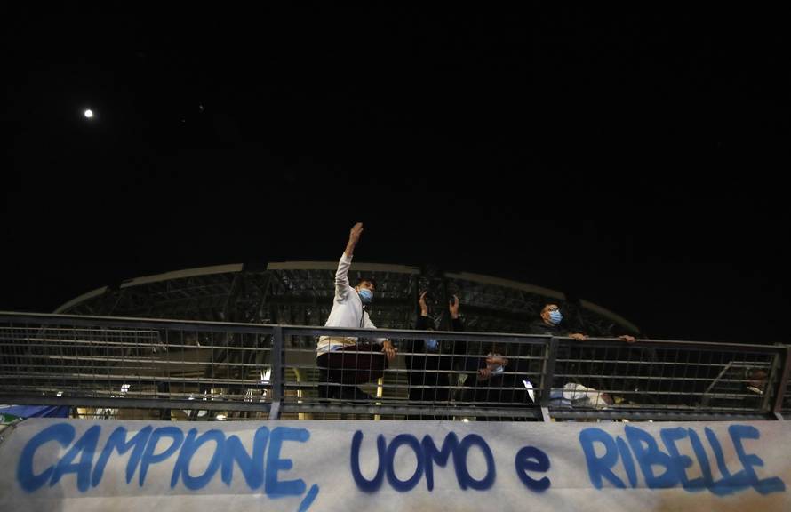 People mourn the death of Argentine soccer legend Diego Maradona, in Naples