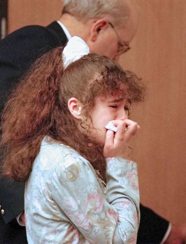 Christa Pike is escorted from Knox County Criminal Court in Knoxville, Tennessee