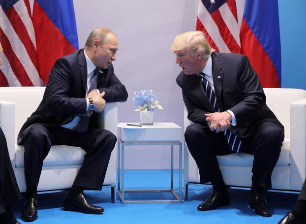 U.S. President Donald Trump speaks with Russian President Vladimir Putin during their bilateral meeting at the G20 summit in Hamburg