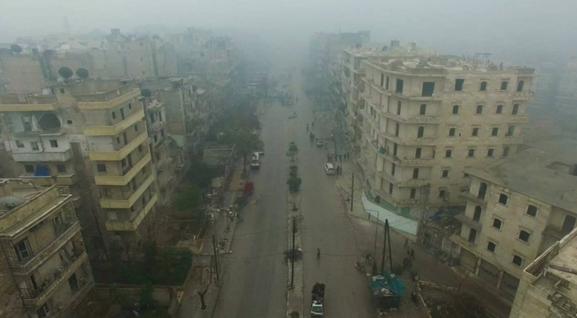 A still image from video taken December 13, 2016 of a general view of eastern Aleppo, Syria in the rain