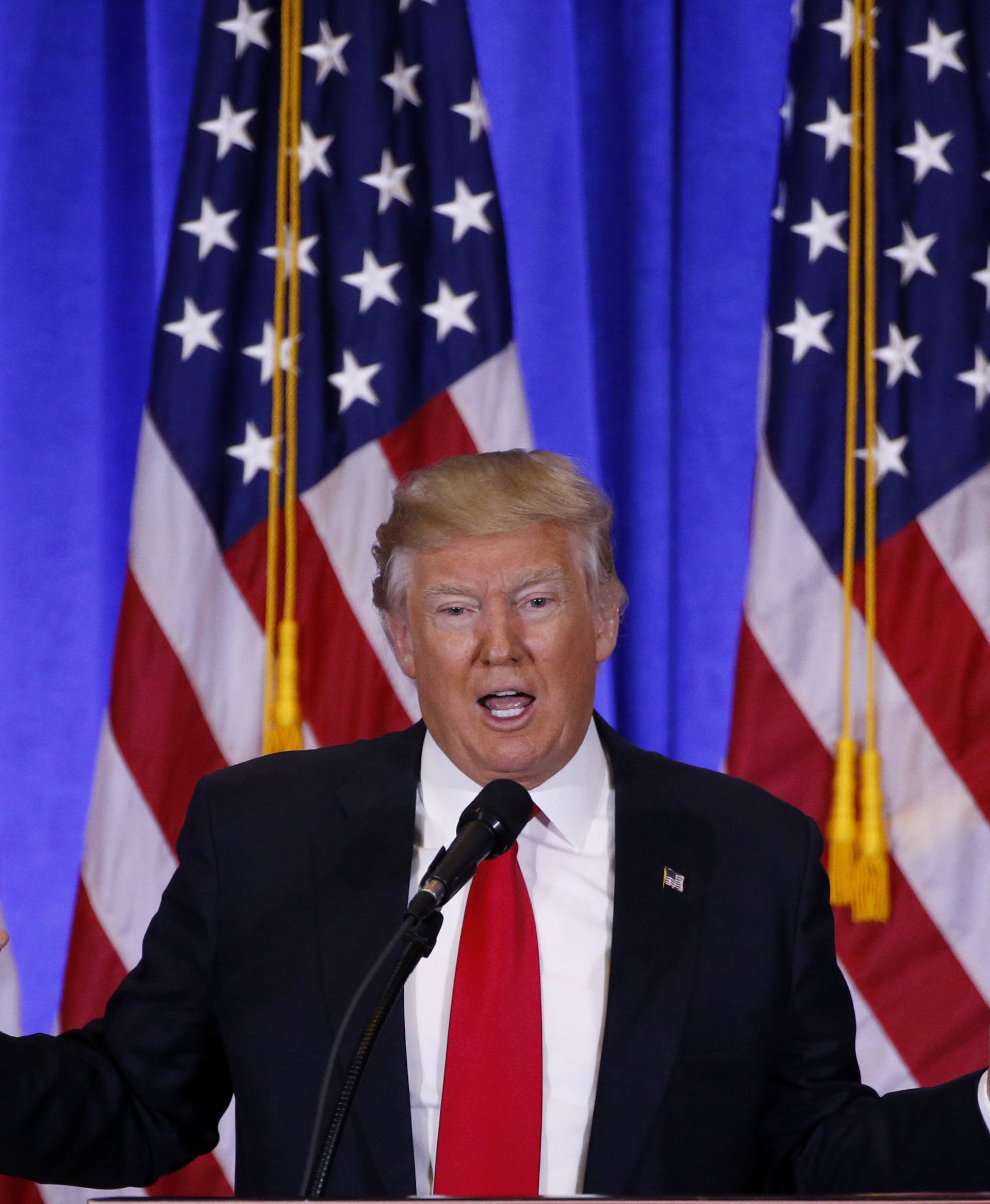U.S. President-elect Donald Trump speaks during a news conference in the lobby of Trump Tower in Manhattan, New York City