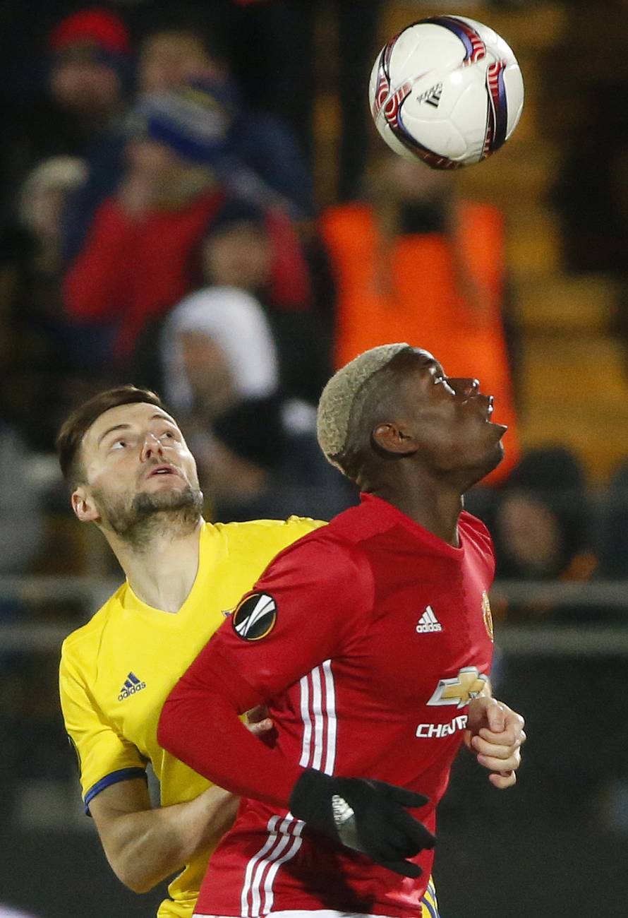 FC Rostov's Vladimir Granat in action with Manchester United's Paul Pogba