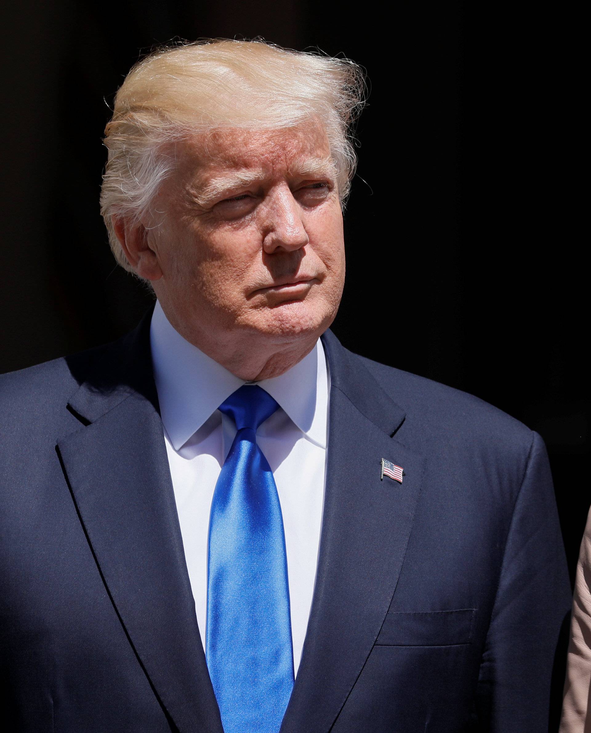 U.S. President Trump and first lady Melania Trump wait the arrival of French President Macron before a lunch ahead of a NATO Summit in Brussels