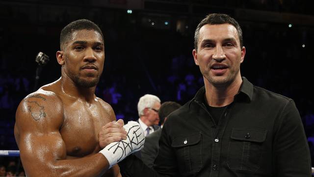 Anthony Joshua celebrates his win with Wladimir Klitschko