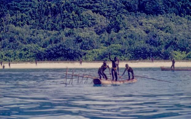 North Sentinelese native tribals negrito negra jarwa tribe in boat North Sentinel Island Andaman and Nicobar Islands India Asia negro negrita jarawa jarawas people