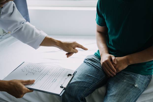 close up of patient and doctor taking notes