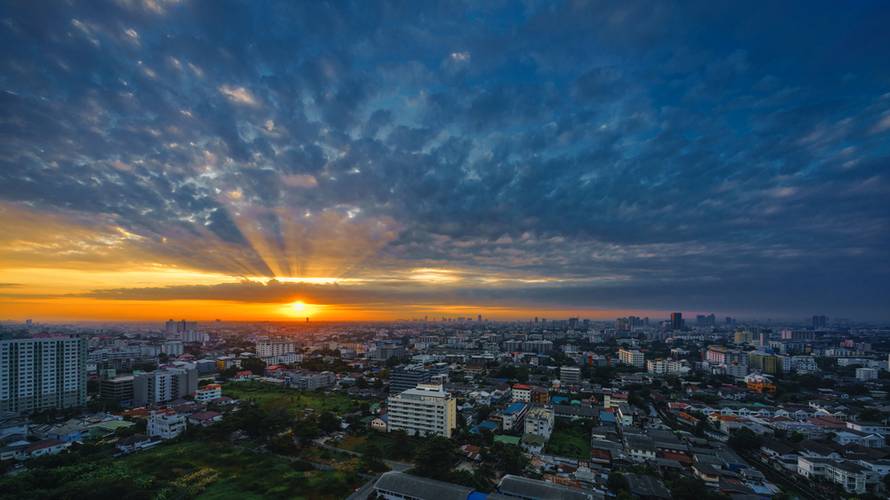 Dawn,And,Ray,Of,Sunrise,Over,The,High,Building,And