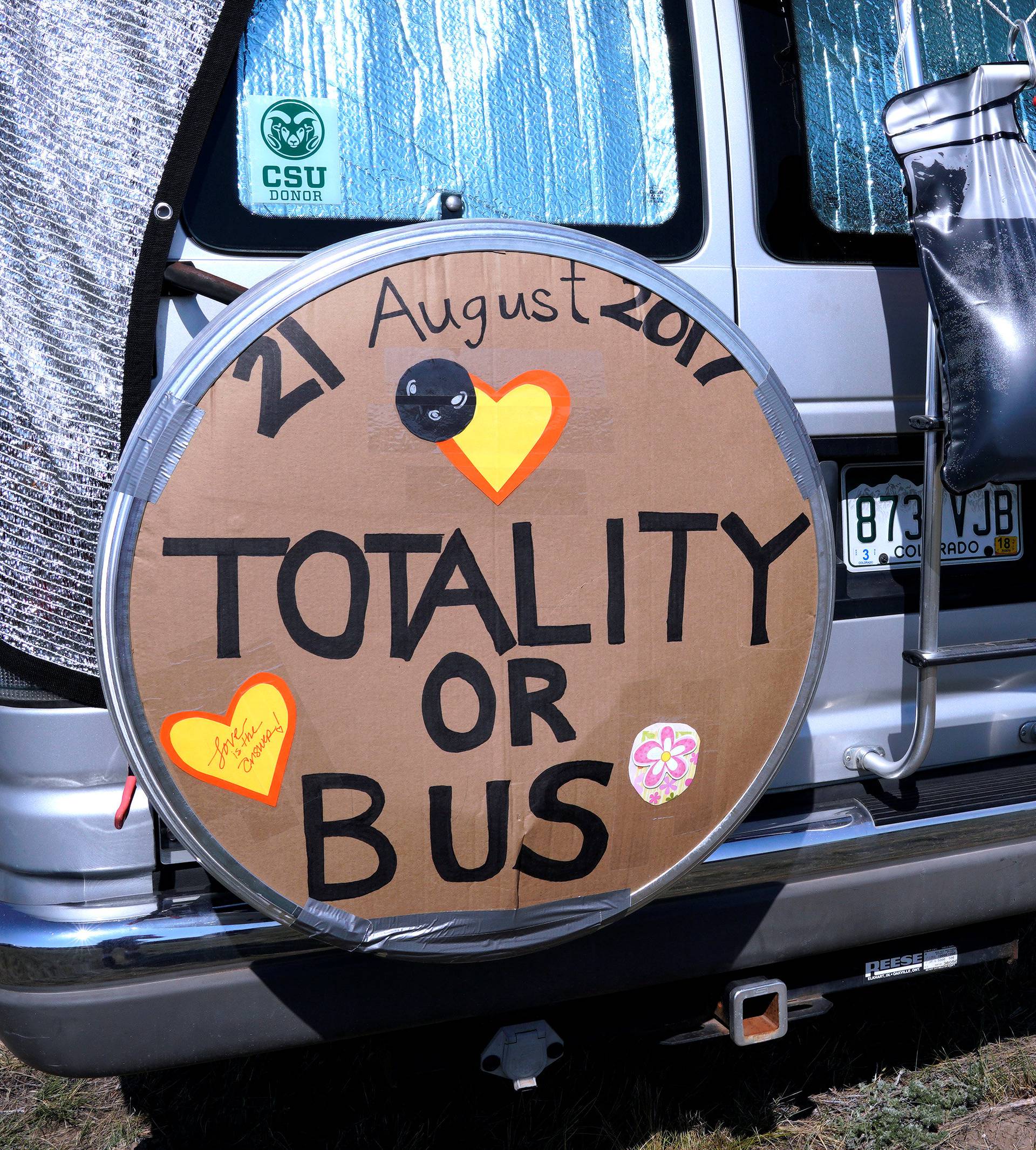 A minibus parked in a designated eclipse viewing area is seen in a campground near Guernsey