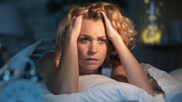 depressed woman awake in the night