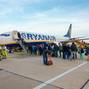 Passengers boarding on the aircraft of low cost airline company Ryanair