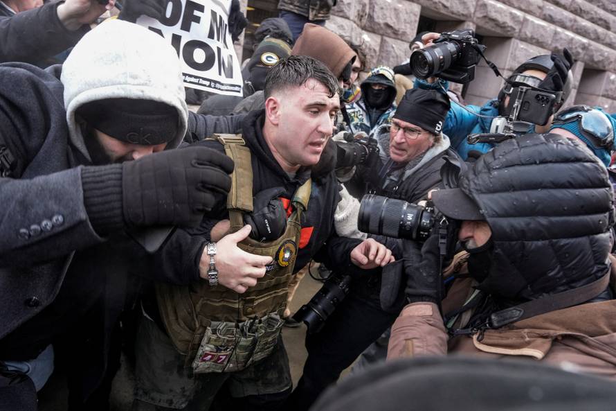 People attend the "March Against Minnesota Fraud" in Minneapolis