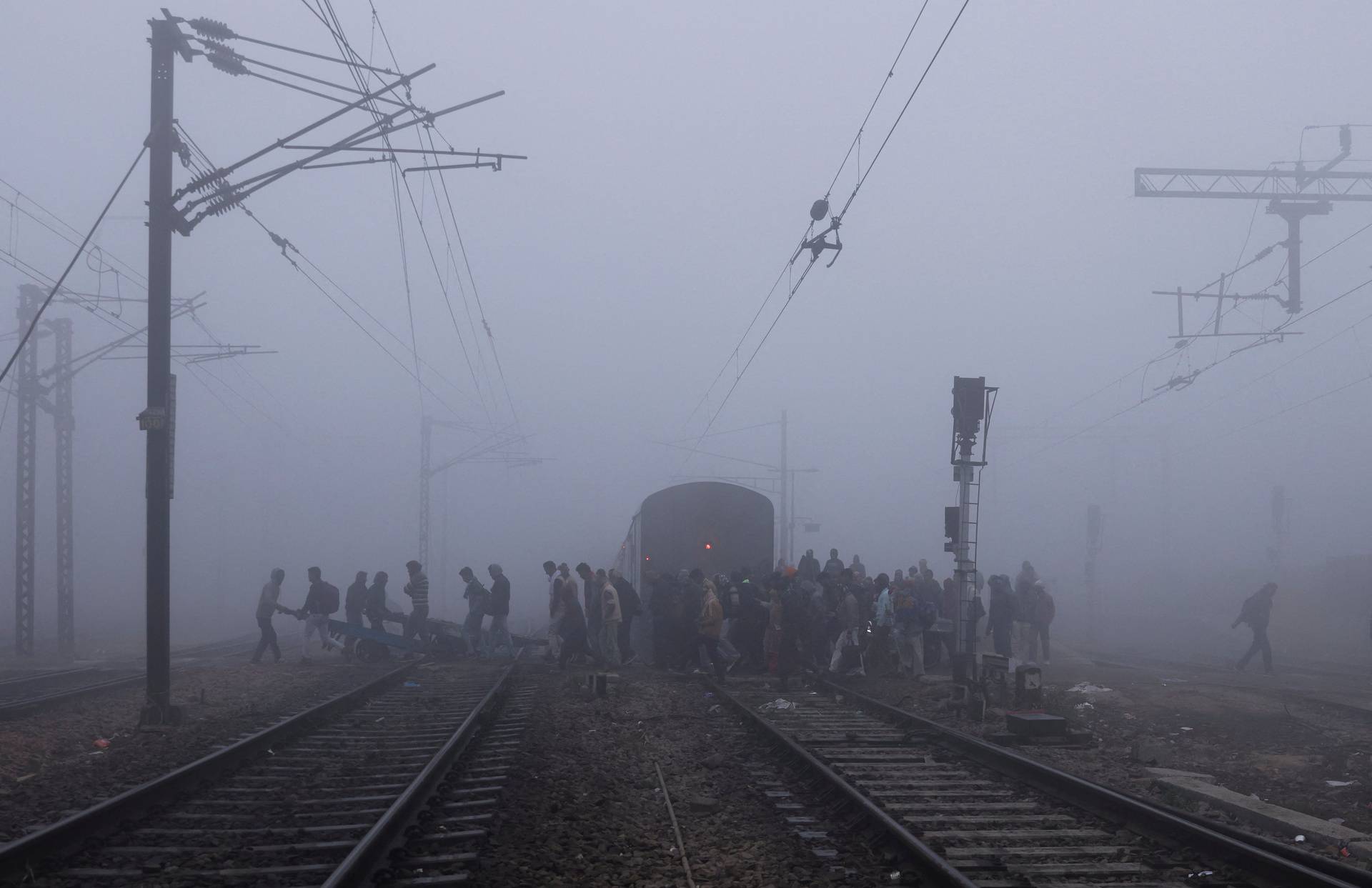 Railway tracks amidst heavy fog on a cold winter morning in New Delhi