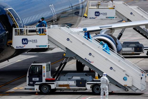 Passengers of the cruise ship MV Hondius, which was affected by a hantavirus outbreak, arrive at Tenerife Sud airport