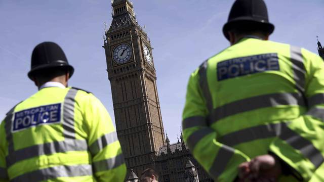 Police officers patrol in Parliament Square following the attack in Westminster earlier in the week, in central London