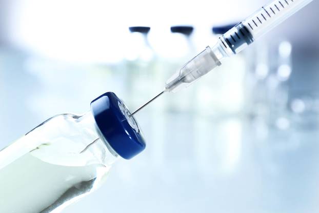 Vaccine in vial with syringe