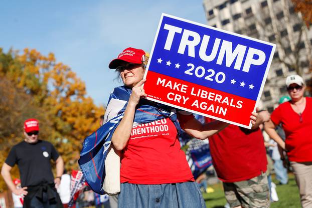 Supporters of U.S. President Donald Trump rally outside the State Capitol building as votes continue to be counted following the 2020 U.S. presidential election, in Lansing