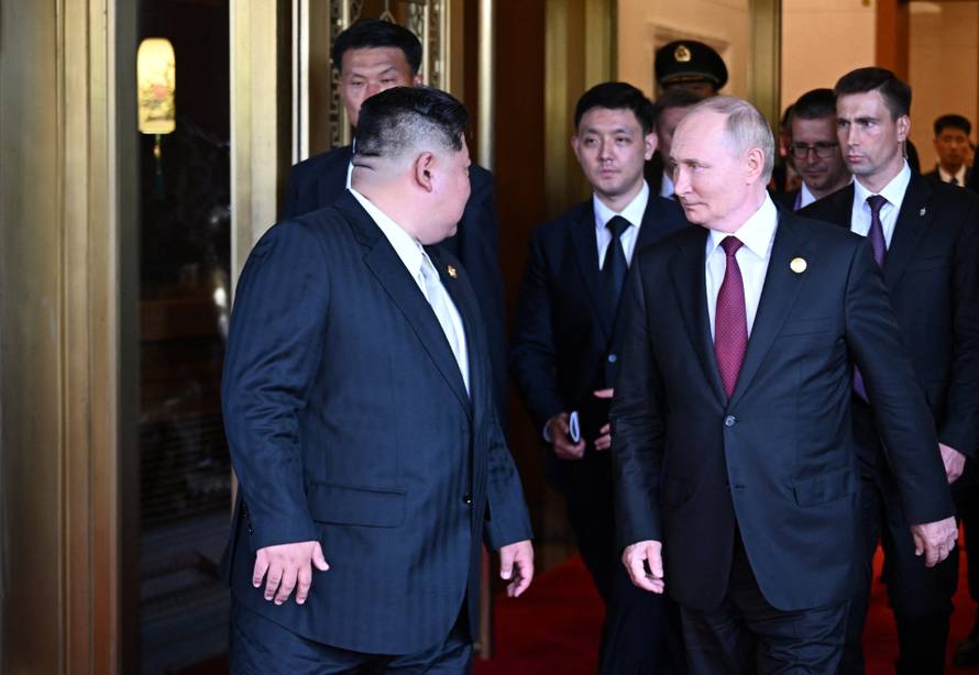 Russian President Vladimir Putin meets with North Korean leader Kim Jong Un in Beijing