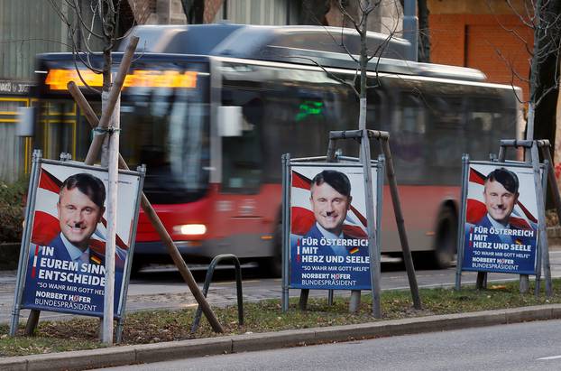 Presidential election campaign posters of far-right FPOe candidate Hofer defaced to make him look like Adolf Hitler are seen in Vienna