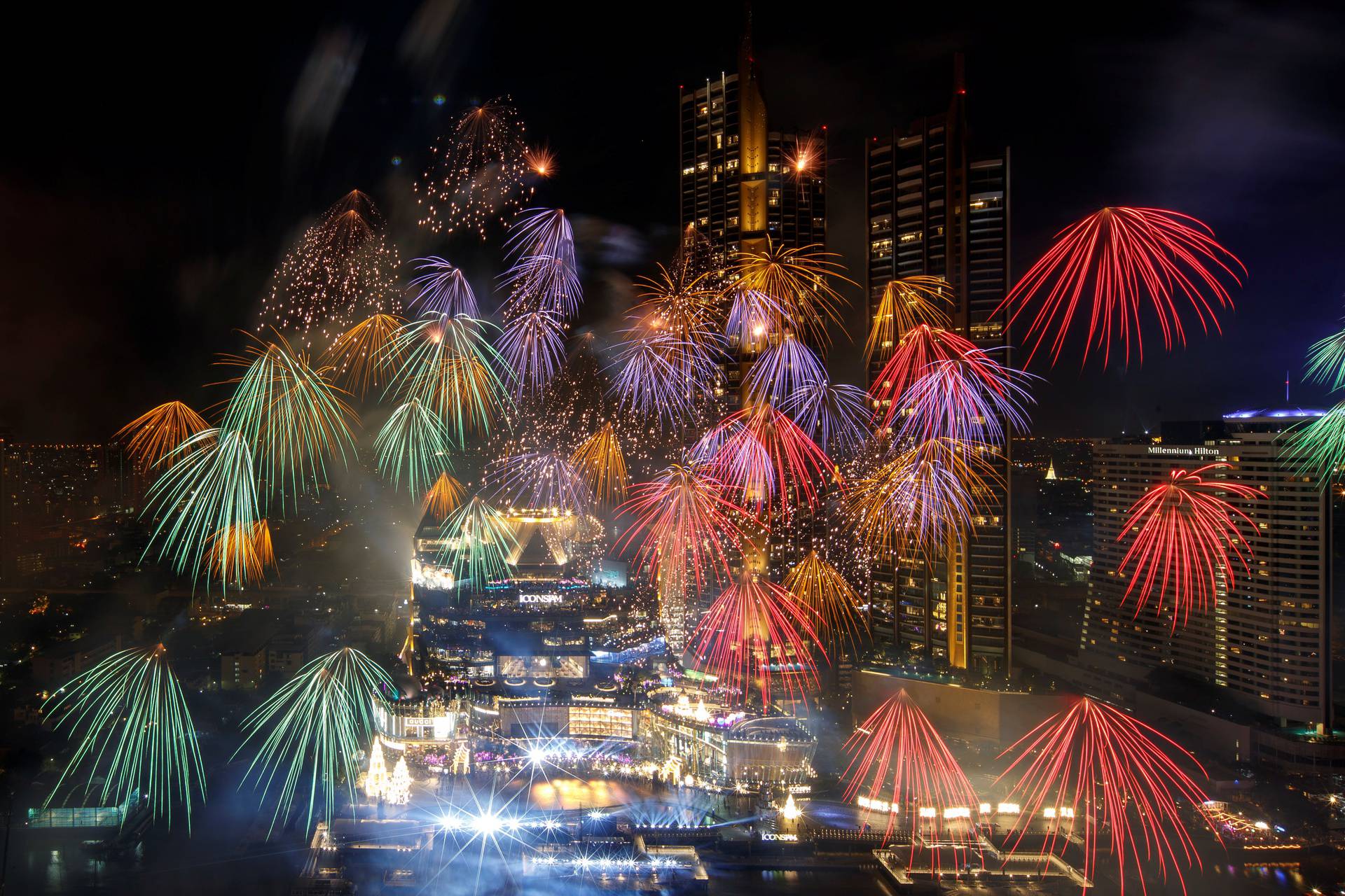 Fireworks explode over Chao Phraya River during the New Year celebrations amid the spread of the coronavirus disease (COVID-19) in Bangkok