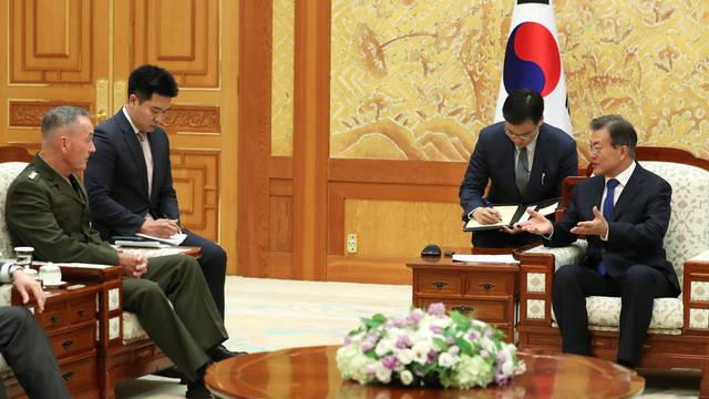 South Korean President Moon Jae-in talks with U.S. Chairman of the Joint Chiefs of Staff Gen. Joseph Dunford during their meeting at the Presidential Blue House in Seoul