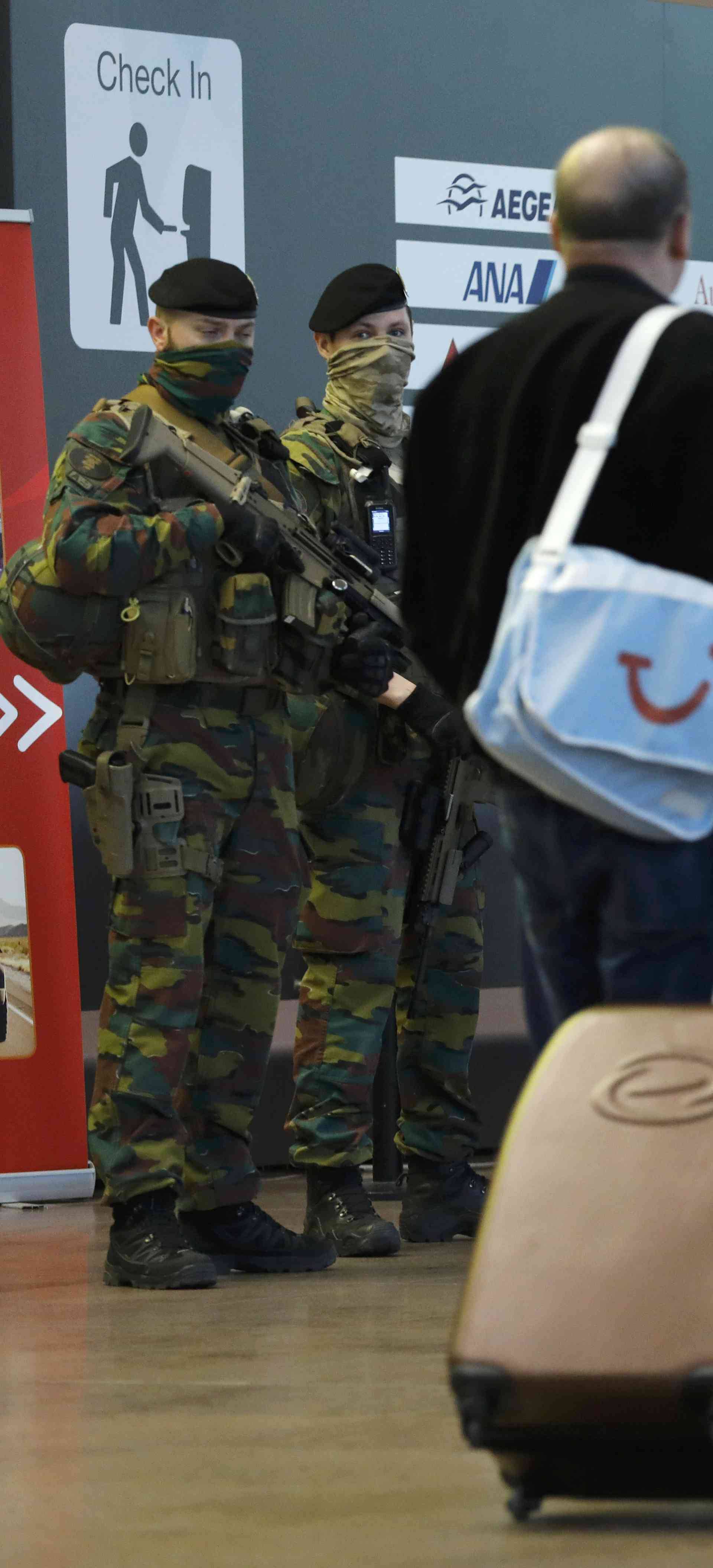 Soldiers patrol in the Zaventem airport prior to a ceremony commemorating the first anniversary of twin attacks at Brussels airport and a metro train in Brussels