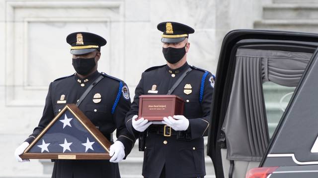 The cremated remains of U.S. Capitol Police officer Brian Sicknick depart the U.S. Capitol after resting in honor.