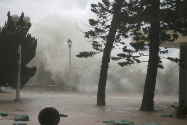 High waves hit the shore at Heng Fa Chuen, a residental district near the waterfront, as Typhoon Mangkhut slams Hong Kong