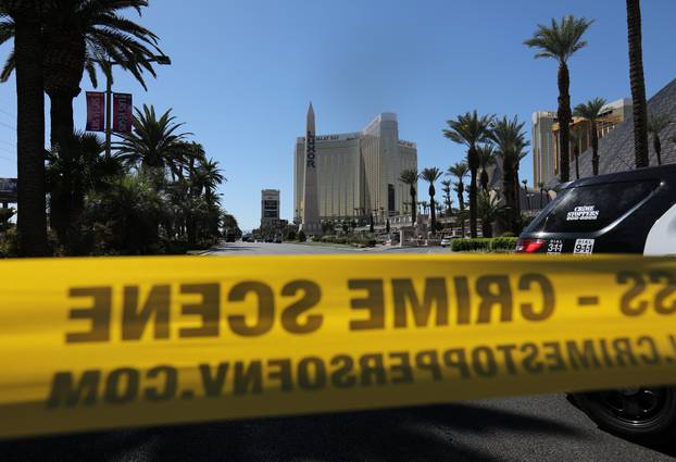 Police crime scene tape marks a perimeter outside the Luxor Las Vegas hotel and the Mandalay Bay Resort and Casino in Las Vegas