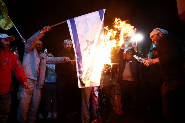 People gather after a two-week ceasefire in the Iran war was announced, in Tehran