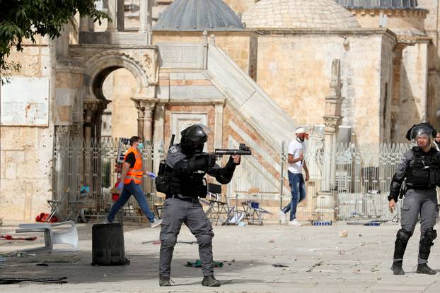 Israeli police clash with Palestinians at the compound that houses Al-Aqsa Mosque in Jerusalem