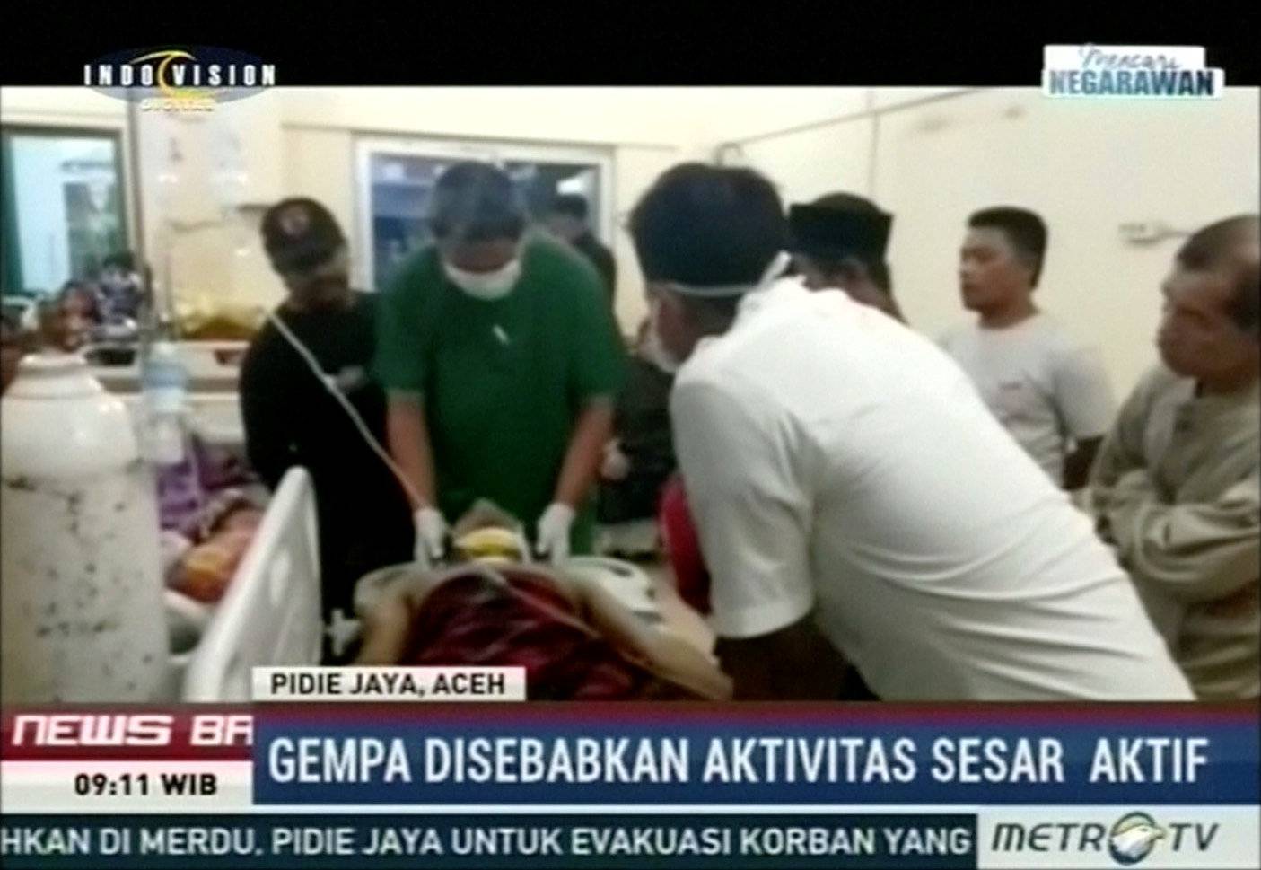 A doctor examines a patient in a hospital following an earthquake in Pidie Jaya, Aceh, Indonesia in this still frame taken from video